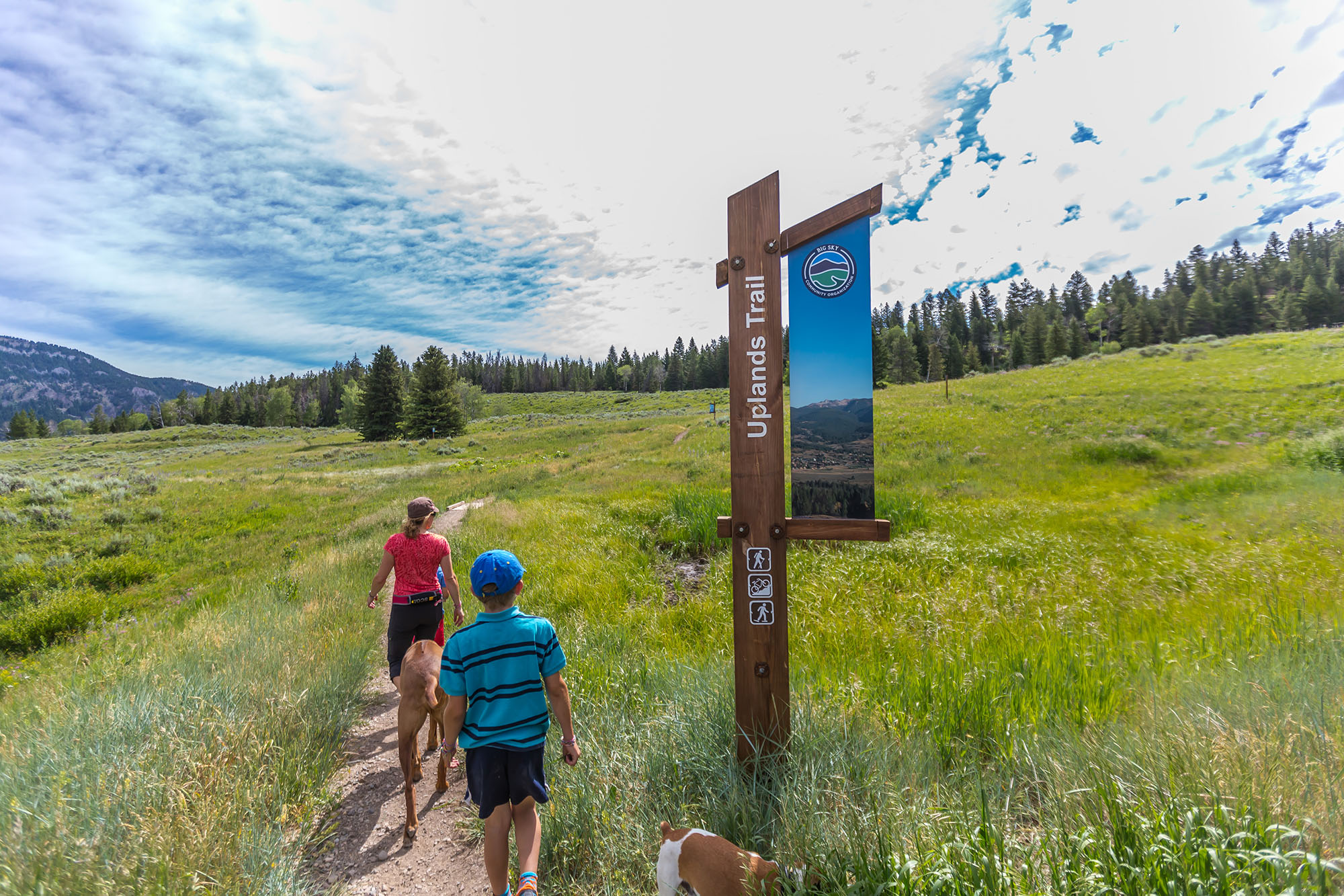 Hikers heading up Uplands trail in Big Sky